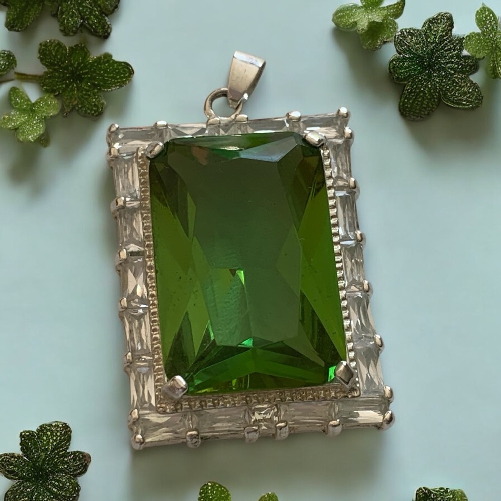 Emerald cut glass stone with genuine quartz baguettes Sterling silver plated.